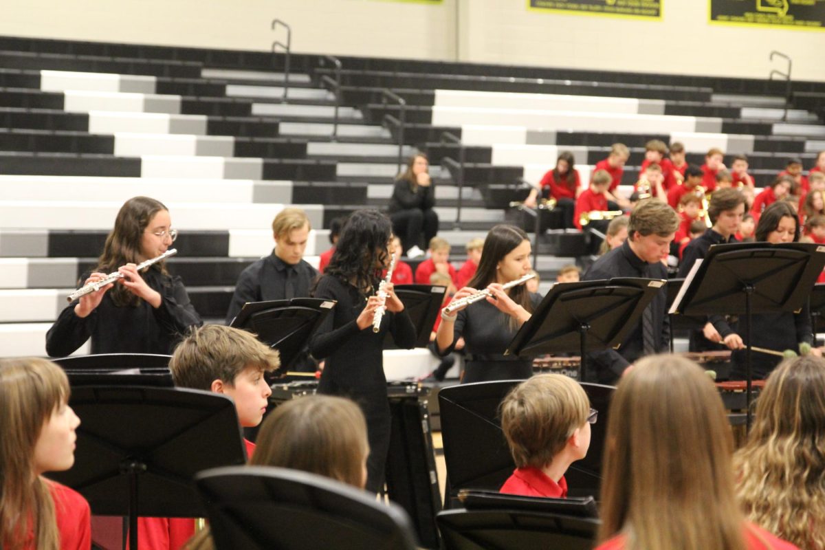 Wind ensemble flautists seniors Gracie Hagen and Gauri Kathula and sophomore Claire Eltoft play with and Percussion 1 members juniors Thomas Morgan and Sam Schoening in a piece called “Queen of Sheba."