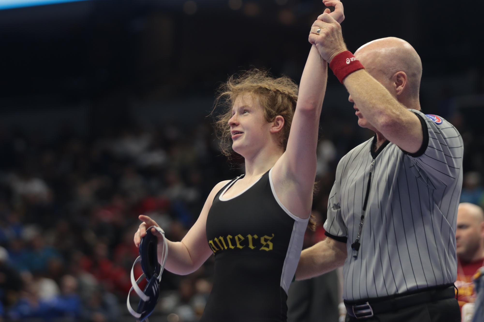 At the Class 2 State tournament, senior Hannah Henderson celebrate after winning a match, Henderson finished 6th at State in her weight class. 