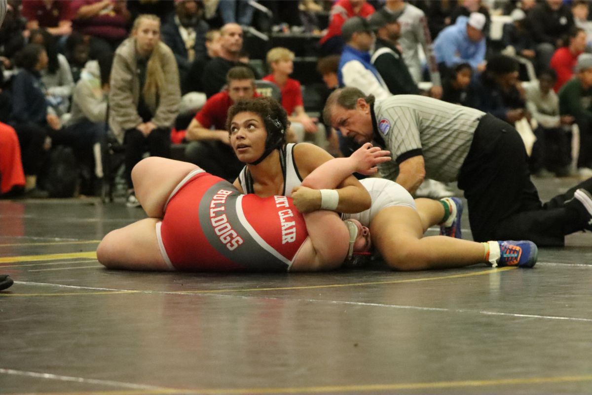 Senior wrestler Aaliyah Grammer holds opponent on her back at the Lafayette "Fred Ross" Tournament. Grammer won her match and placed first in the tournament.