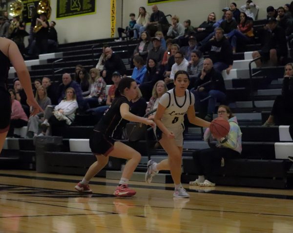 Sophomore guard Maria Golfo dribbles past Parkway Central defender. Golfo scored 10 points, Friday, against the Colts.