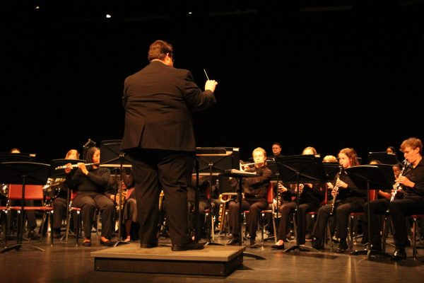 Music teacher Andrew Reader leads Concert Band through the first piece of the night: "Fidelity March."