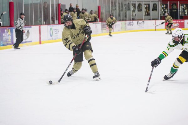 Aaron Keller, in the new home alternate uniform, makes a shot at the goal on senior night against Lindbergh.