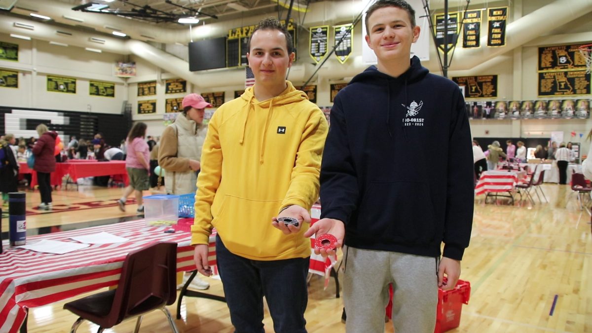 Juniors Connor Kash and Owen Waeckerle at their booth, Washer Toss. They ended the day with 224 tickets.