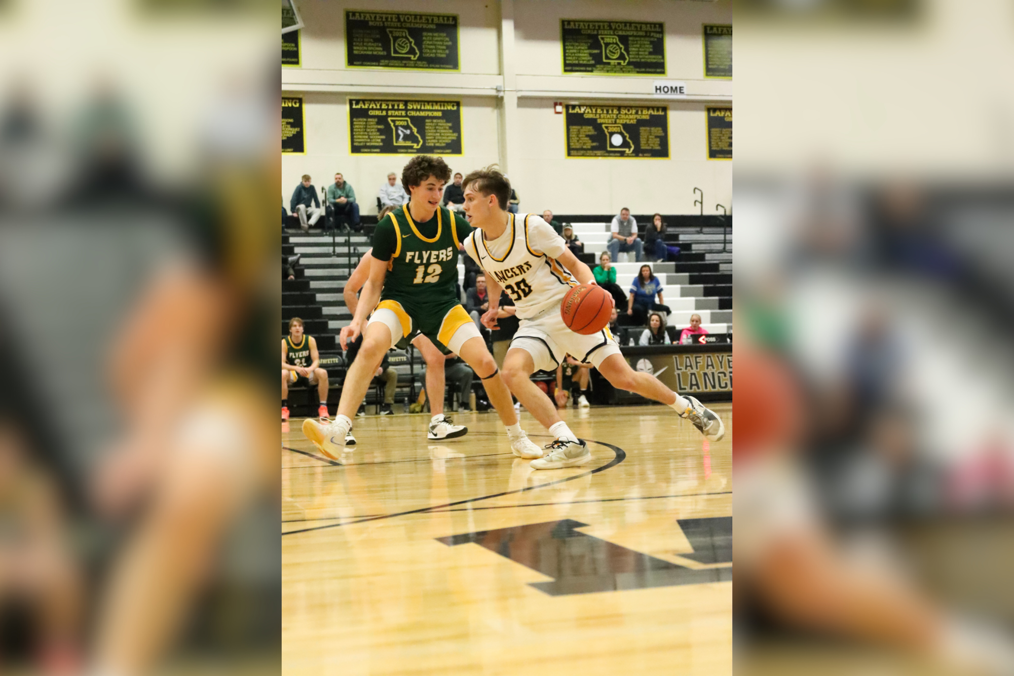 Senior guard Josh Pitney drives to the hoop in a Friday night game against Lindbergh. Lafayette lost this game to bring their record to 8-10.