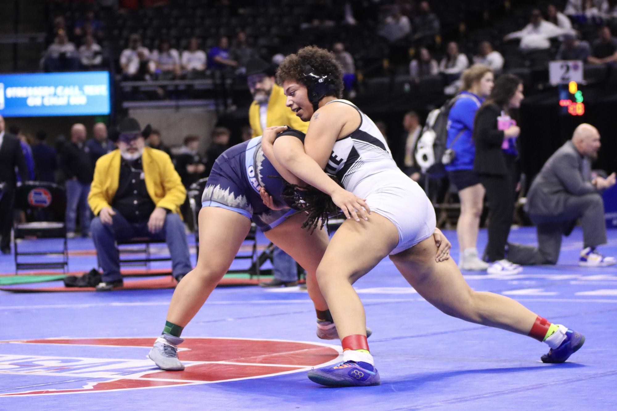 Senior Aaliyah Grammar ties up with Oak Park wrestler, Kendall Angelo in the 190 pound weight Class 2 State final match. The close contest went into double overtime with Grammar falling to Angelo and placing second.