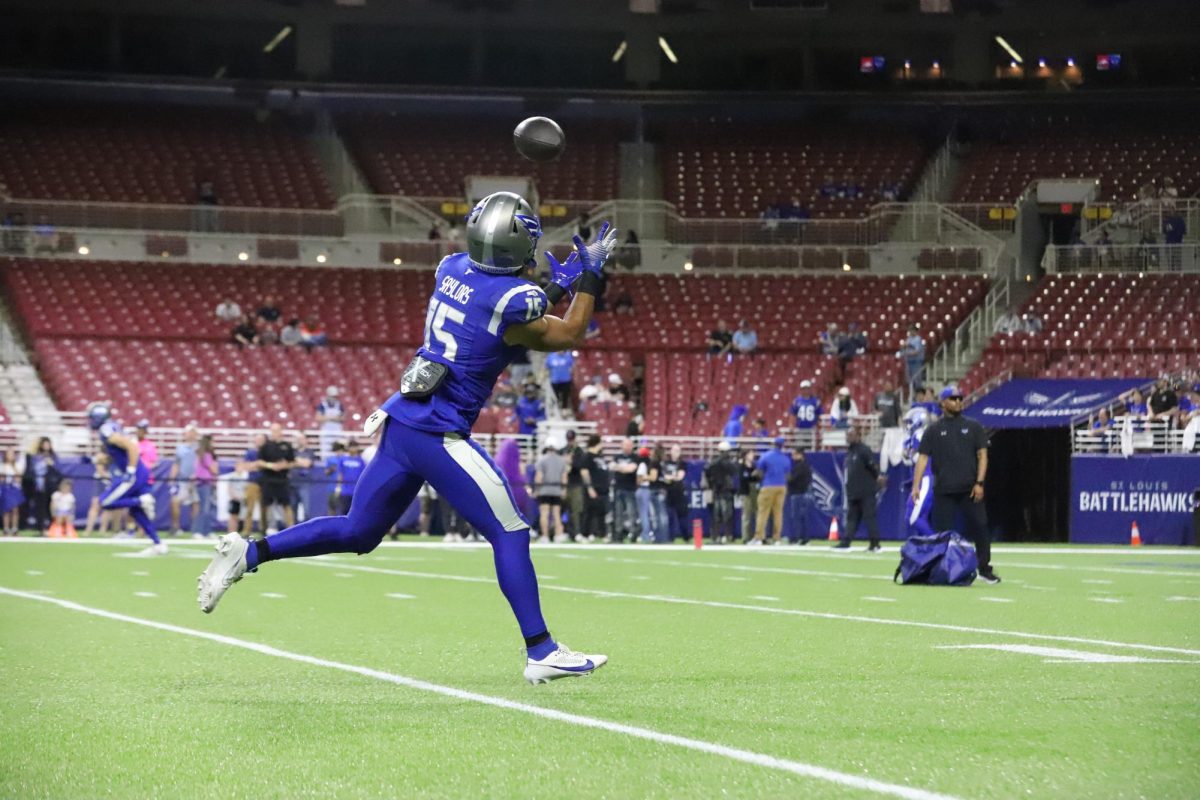 During warmups, running back Jacob Saylors reaches his arms out to catch the ball at The Dome at America's Center on Saturday, May 17. The Battlehawks pulled out a 29-28 win over the Stallions on Saturday.