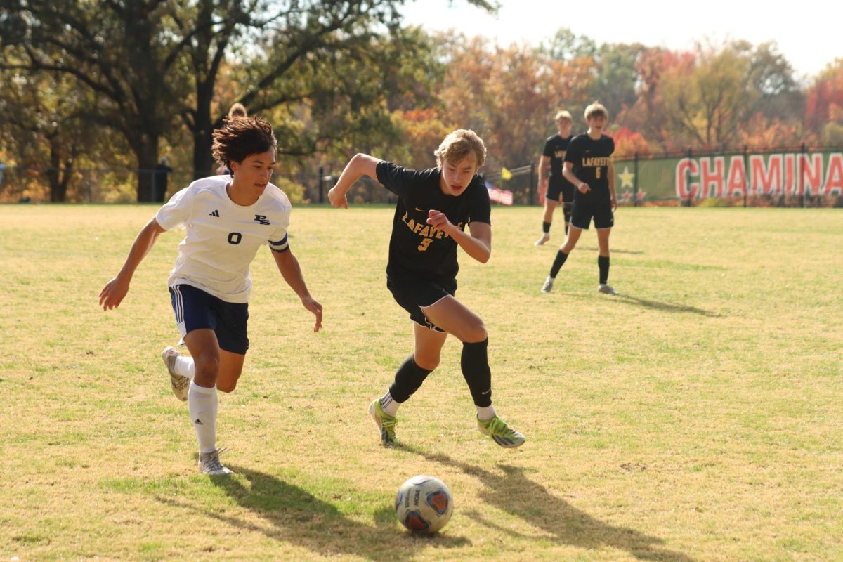 On Nov. 2, 2024, sophomore Kanin Roseman dribbles against Parkway South defender. Roseman was mentioned as a key player to watch this year.