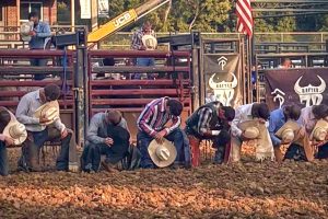 Before his rodeo at the Washington County Fair, senior Finn Cronin kneels down and prays with his fellow riders. "I ask god for protection and then I will get up, put my helmet on, hop behind the chute, dance a little bit and get the wiggles out,” Cronin said.