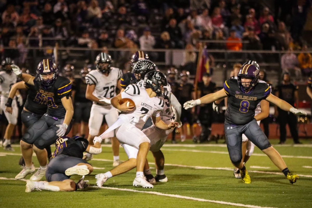 To avoid a sack, senior quarterback Brady Micek rushes out of the pocket, making a positive play. Micek led Lafayette to win over rivals Eureka in the Battle of 109 with his 241 passing yards and 80  rushing yards. 