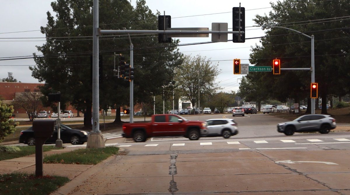 Cars pass one muggy morning outside of Marquette High School, October 7, 2025