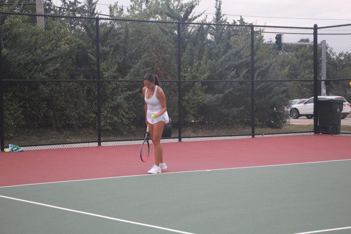 In a singles match against Parkway West, senior Mia Yin prepares to serve. This tournament was one of only four losses that the Lafayette team had all season.