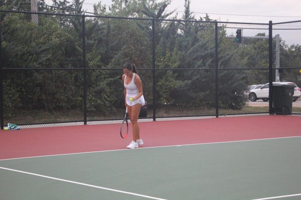 In a singles match against Parkway West, senior Mia Yin prepares to serve. This tournament was one of only four losses that the Lafayette team had all season.