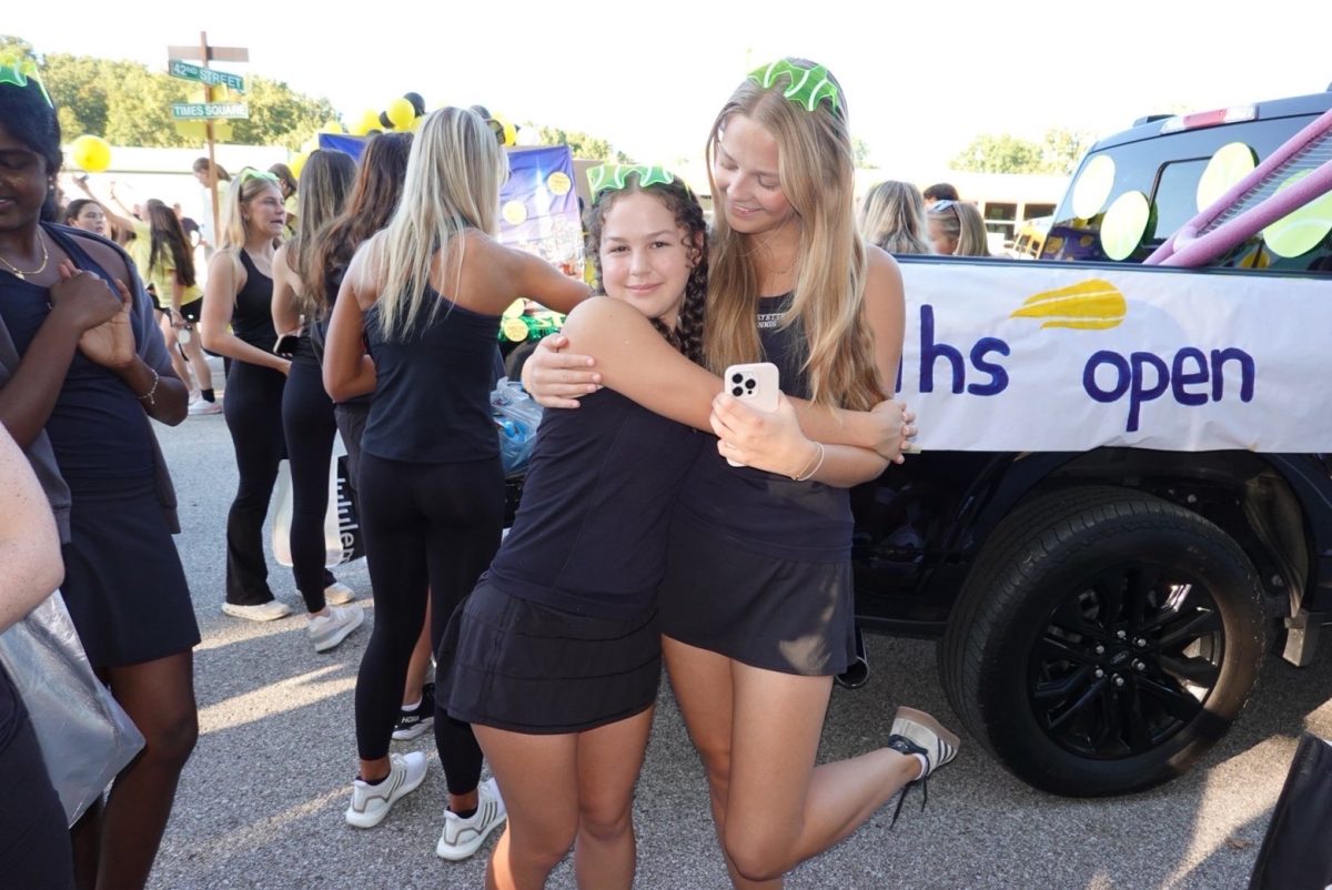 As a part of the tennis team, senior Danish exchange student Sille Thomsen (right) attends the Lafayette Homecoming Parade with junior Allison Jefferies. One of the main reason's why Thomsen wanted to be an exchange student in America was to experience the culture.