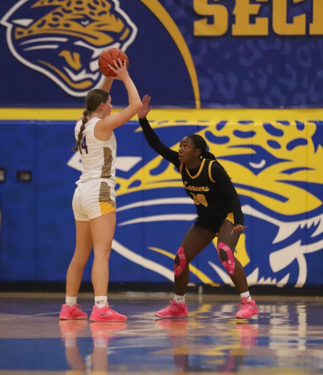 Getting back on defense, sophomore guard Jasmyn Callaham begins to block an attacker. "Jasmyn stepping up there at the end after she got crossed up a little bit, and locking back in just shows a lot about the grit of our girls," Coach Gregg Hrdlicka said.