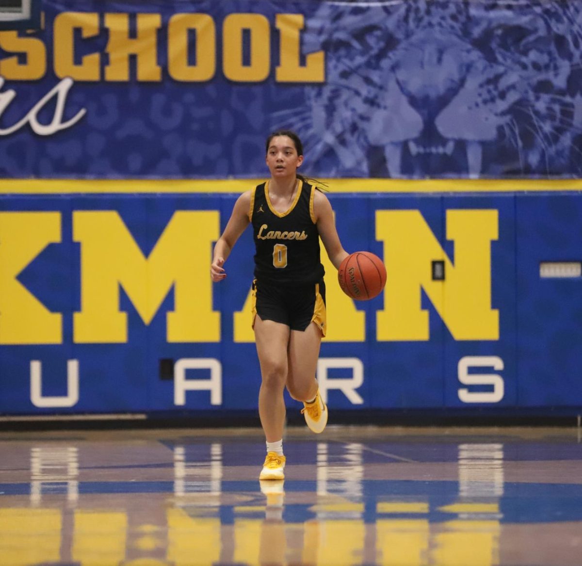 Transitioning into attack, junior guard Maria Golfo collects the ball and begins to dribble down the court. Golfo led the team in rebounds, tallying six on Tuesday night.