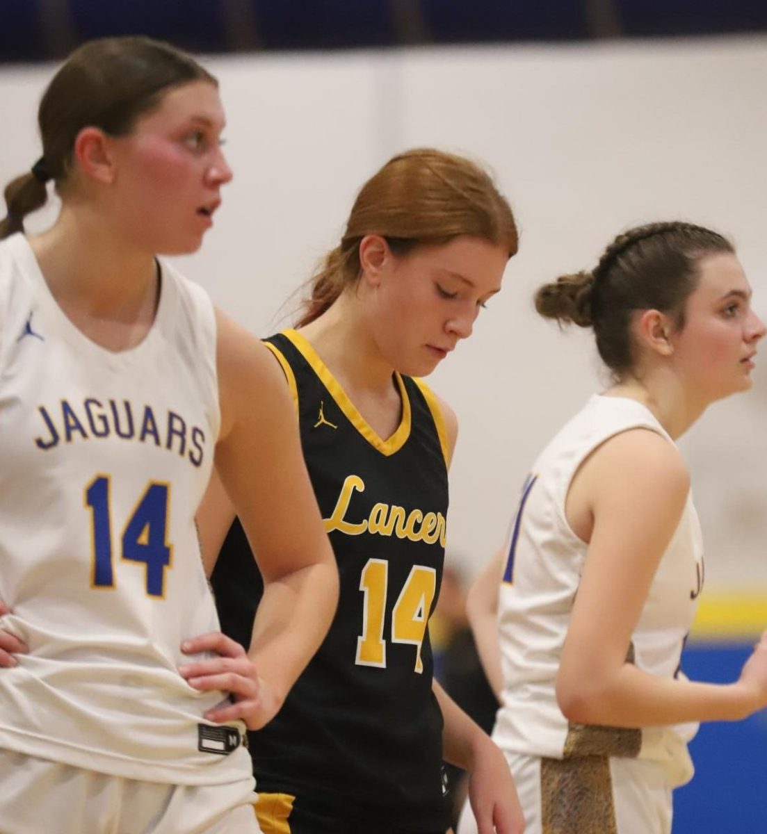 On defense, junior guard Isabelle Hrdlicka occupies a block on the side of the lane before a free throw. "I thought our defense showed out," Coach Gregg Herdlicka said. "Isabelle took away their best shooter for most of the night".