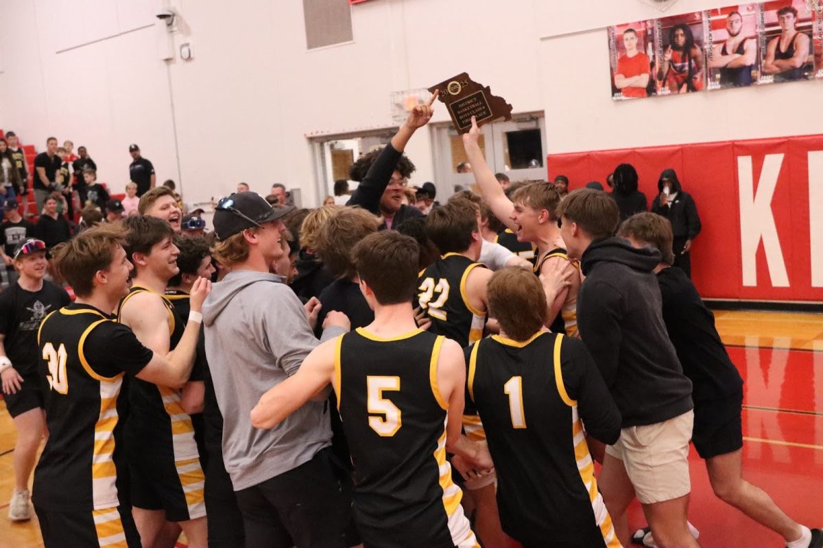 The Lafayette boys basketball team celebrates after winning the district championship game over Marquette, March 10, 2025. The Lancers beat the top seeded Mustangs in a 76-65 contest to proceed to the MSHSAA Class 5 State Quarterfinal game.
