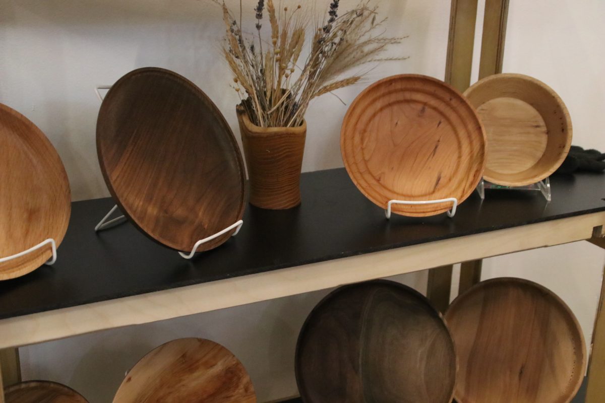 Woodturned bowls and vases crafted by AION WoodCrafts owner David Aion are displayed at his booth. Products can be purchased on his website.