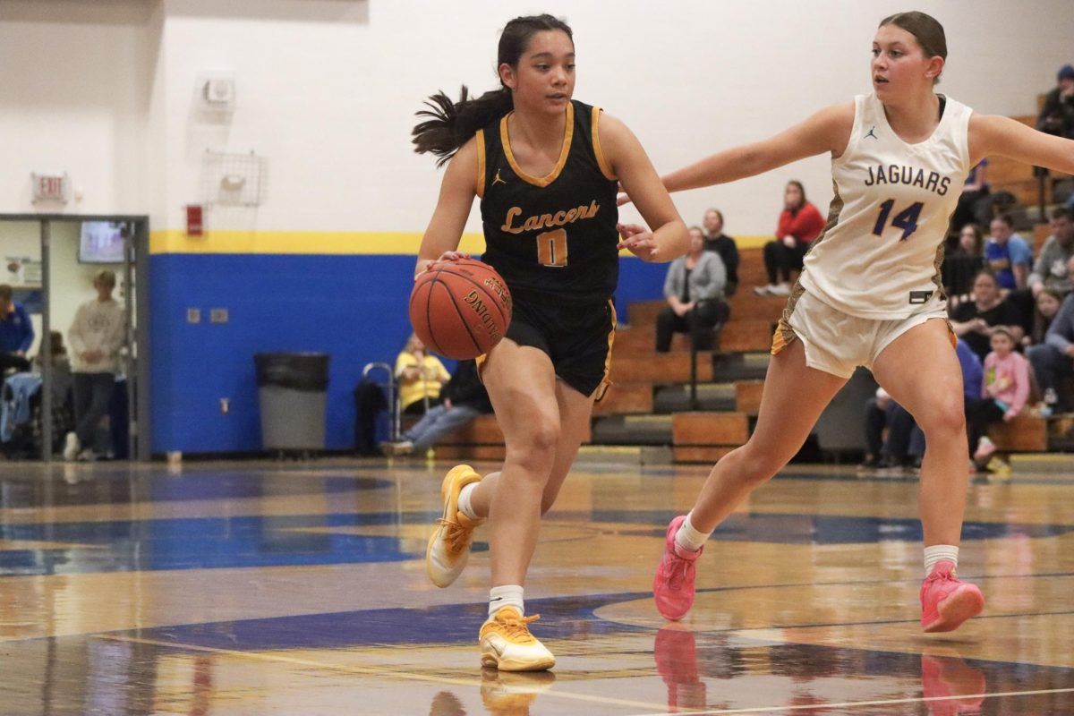 Trailed by a defender, junior guard Maria Golfo races towards the hoop. Golfo scored 19 points, according to STL High School Sports.
