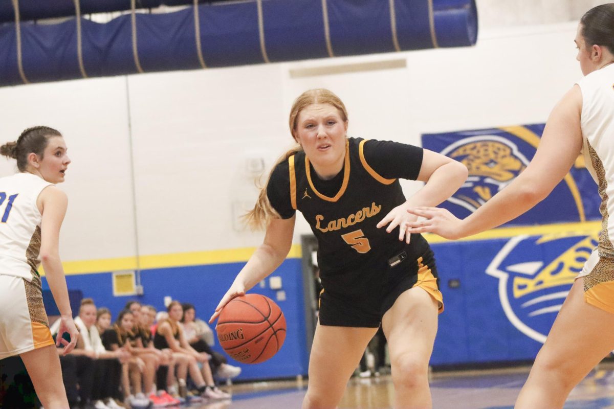 While dribbling, senior forward Annika Kivisikk looks for an opening. Kivisikk and teammate Annie Kirtley "really battled [Seckman's] 6-foot-4 girl," Coach Gregg Hrdlicka said.
