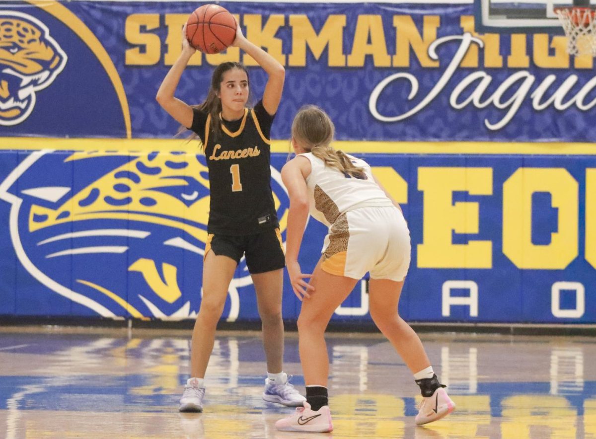 Eyes fixed ahead, junior guard Lylah Kimberlin looks for a teammate to make a pass. "Our team chemistry was good," Kimberlin reflected. "We played really well together."