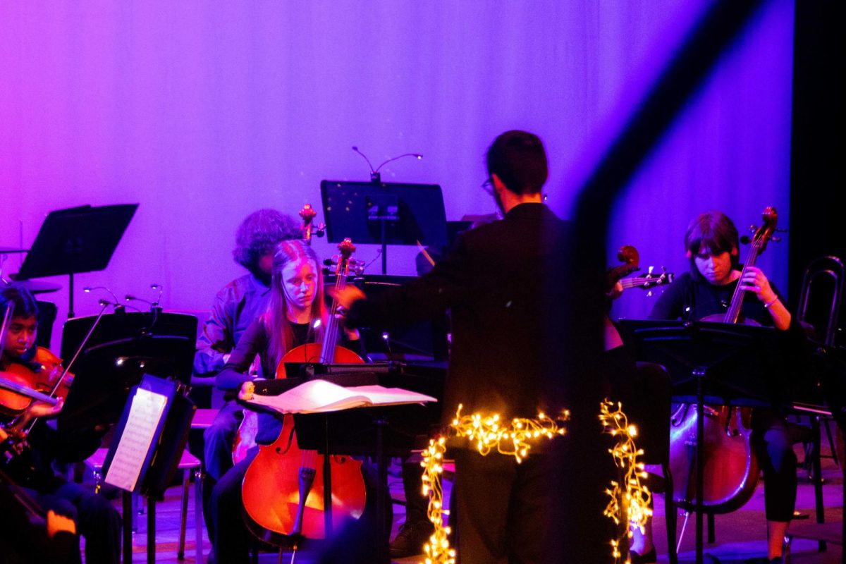 Orchestra teacher Chris Livesay conducts during the Winter Pop concert on Thursday, December 11, 2025.