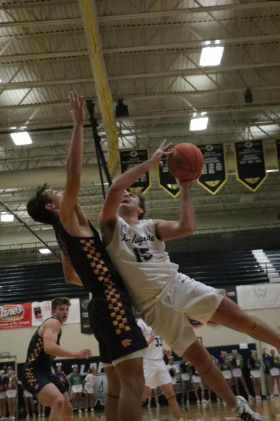 In the paint, senior forward Drew Pickering attempts to get a shot off, in the Battle of 109. The rivalry match-up remained close all game, before Eureka pulled away late, winning 56-53. 
