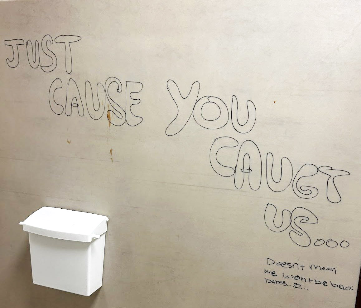 Apparently directed to administration, student vandals write, "Just cause you caught us... doesn't mean we won't be back babes." 