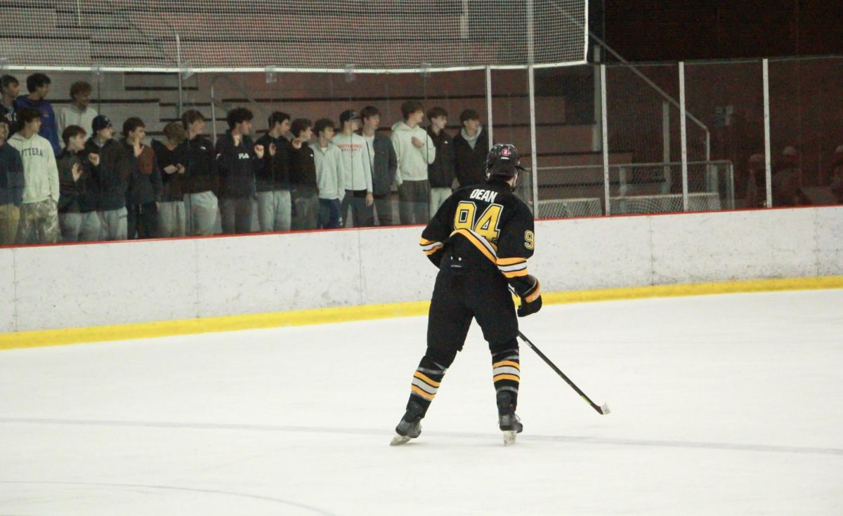 On defense, junior defenseman Sean Dean faces a crowd of onlookers. "I gave it my all and played a very physical game," Dean said.