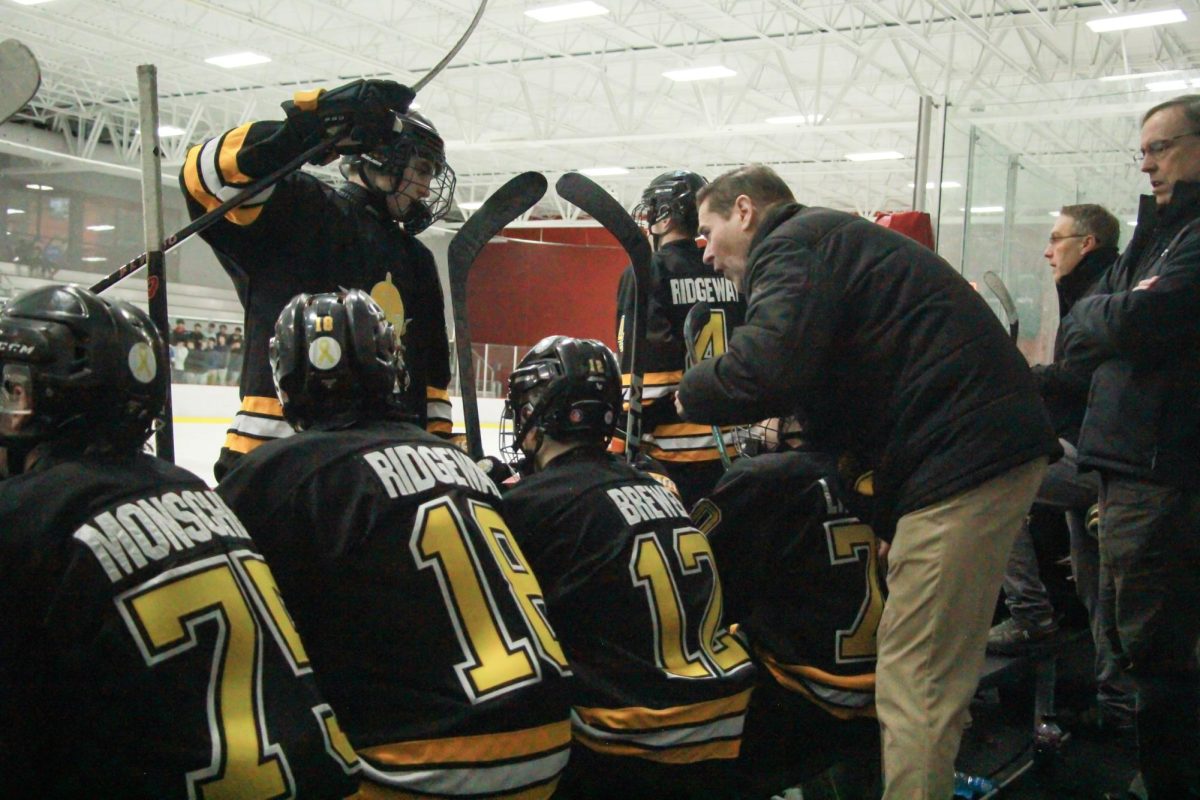 Between plays, coach Jim Carrico gives his team pointers. "After the second period, [Clayton] scored one goal on [Lafayette], so we talked about hopefully getting the bounces we needed," Carrico said.