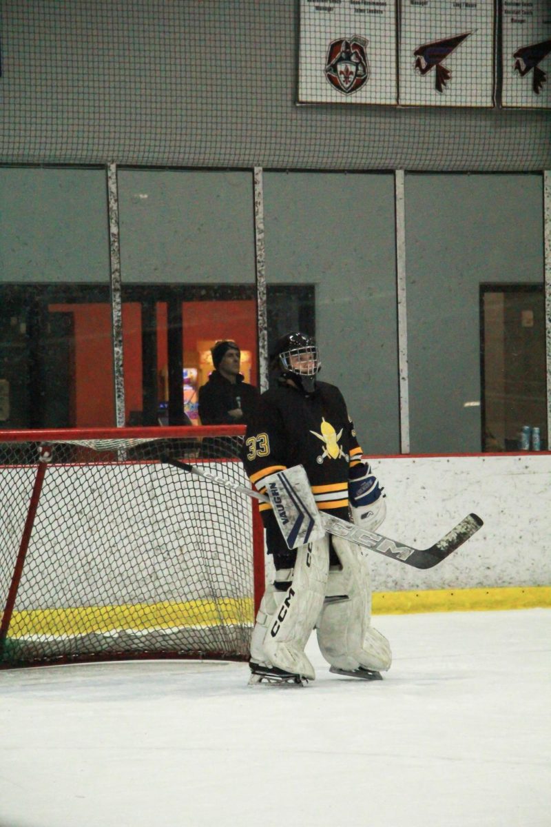 Defending the goal, freshman goaltender Peter Tomaras stands guard. Tomaras made a notable save during third period, keeping the Lancers' lead of 4-1. "Tomaras in goal has been rock solid for us," coach Jim Carrico said.
