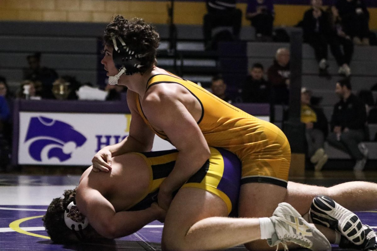At the 215 pound weight class, junior Carter Brown lays on top of a Eureka wrestler. Brown won his match and helped the Lancers win the Battle of 109 duel 73-0.