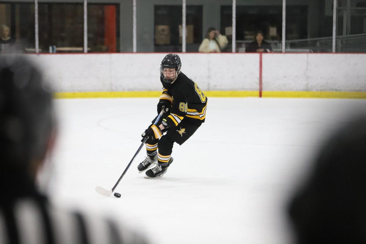 At Maryville University Hockey Center on Tuesday, Feb. 17, junior forward Turner Allen skates with the puck in the defensive half of the rink. Lafayette defeated Clayton, 6-1, with a hattrick from sophomore forward Luke Ross.