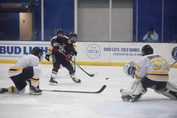 At Centene Community Ice Center, a Rockwood Summit forward shoots the puck at sophomore goalkeeper Peter Tomaras while under pressure from multiple Lafayette defenders. The Lancers lost the first game of the two-game series to the Falcons, 4-1, but will meet again at the center, Feb. 20, at 1:30 p.m. "We need to get dialed in and really have a good warmup and get our bodies moving so we can come out fast and ready to go at puck drop," junior defenseman Quentin Parks said.