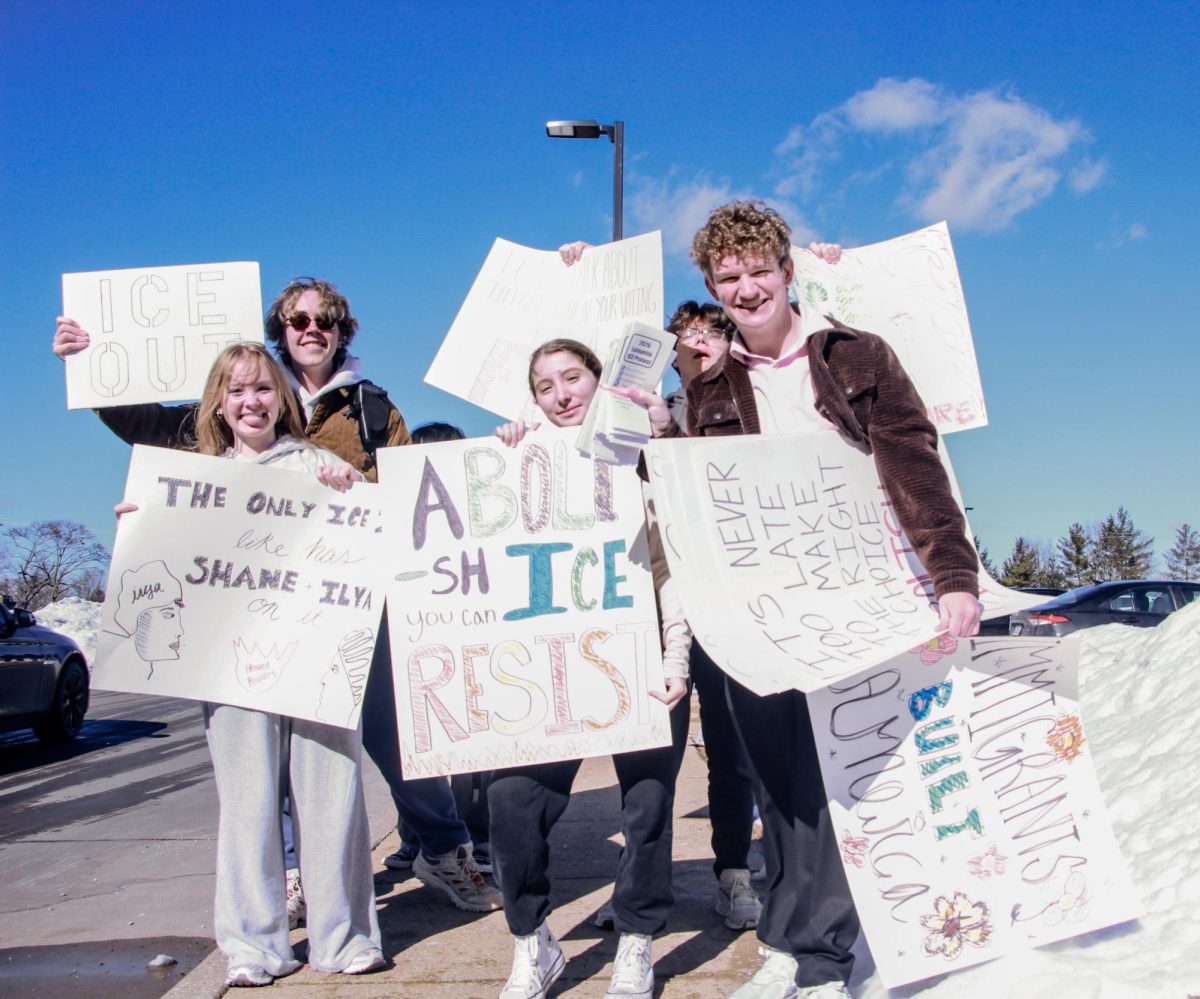 From left: freshmen Mollie Martin, William Webb and Alexis Kavadas and seniors Lance Darabcsek and Logan Martin pose for a picture. "I think the majority of people being deported don't have a criminal record and work here legally on green cards," Kavadas said.