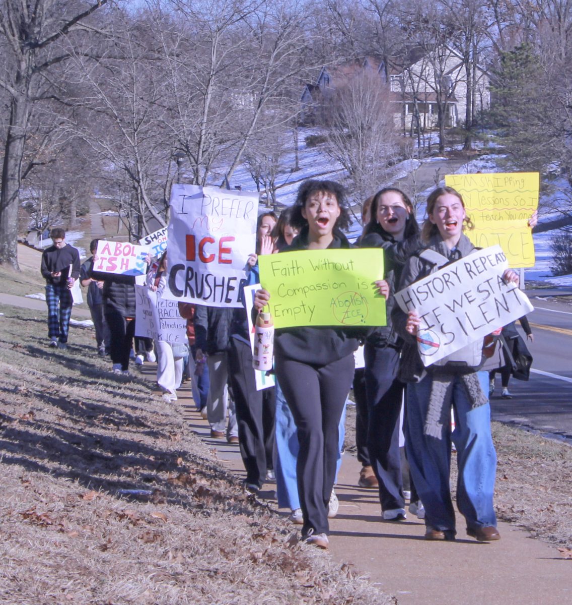 Leading the march, sophomores Chelsea Akufuna and Zoe Faw call out to the streets for political reform. "Doing whatever we can to help and protect each other is so much greater than any punishment the school would have given us," Faw said about risking detention to protest. 