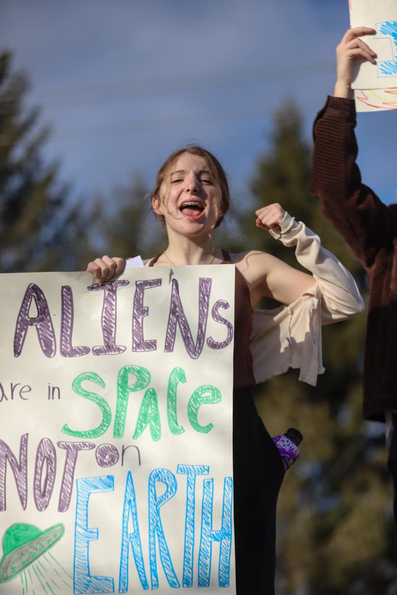 Holding a sign that says "Aliens are in space, not on Earth," freshman Alexis Kavadas yells a chant. "I had a lot of support from my family and friends. Everyone was totally okay with me walking out and overall, it turned out to be an amazing experience," Kavadas said.