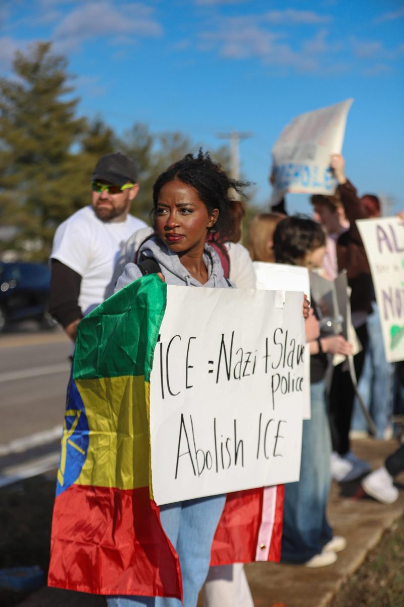 Despite not being a student at Lafayette, Sabie Witt accompanies her sister, sophomore Saphine Witt, at the protest. Sabie wrapped herself in an Ethiopian flag to display her pride in her heritage. "Bringing the flag to the protest where the point was to advocate and raise awareness of the hatred towards immigrants, people of color and humanity as a whole was so important because I wanted to show the love that I have inside," Sabie said. 