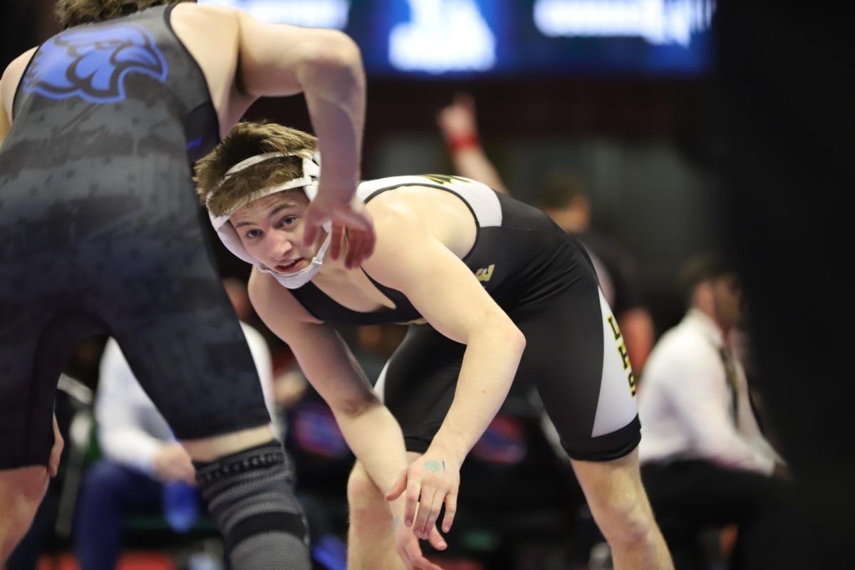 In his semifinal bout, junior Riley Sumner stares down his opponent. Sumner placed fourth in the 126 weight class in boys Class 4 at the 2026 MSHSAA Wrestling Championships on Saturday, Feb. 28. 