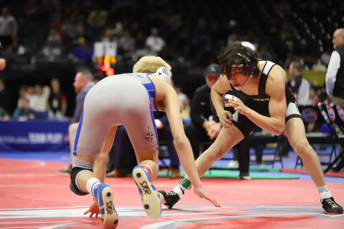 Focusing on sophomore Carson Owens of Seckman High School, junior Caleb Frankenberger circles around his opponent as Owens tries to stand.