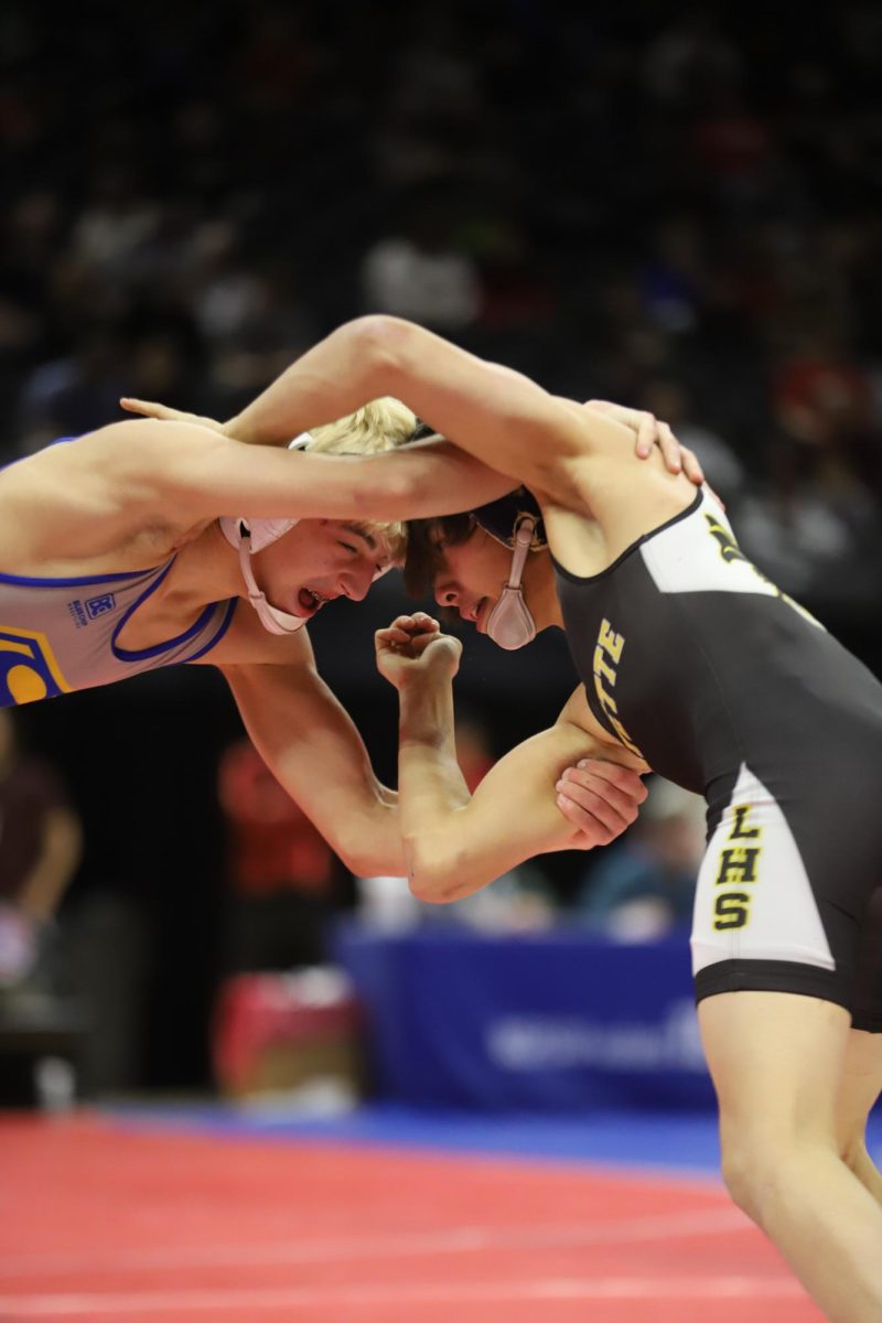 In the 132 weight class semifinal, junior Caleb Frankenberger locks arms with sophomore Carson Owens of Seckman High School. Frankenberger placed sixth in his weight class and the Lafayette boys wrestling team placed fifth overall in Class 4. "There were some places where we could have performed a little better but it's hard to be upset with a team with a fifth place finish overall. We had some guys wrestle outstanding this weekend," coach Sam Ritchie said about the team's performance.