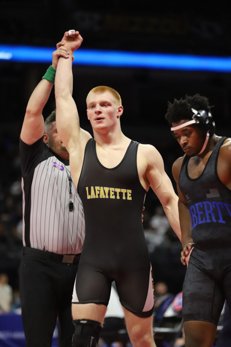 With the referee raising his hand, senior Carter Welsh is identified as the winner of the 175 weight class semi-final bout. Welsh won the match after beating senior Donovan Hodges of Liberty High School by decision, 11-6. "[Welsh] just wrestled out of his shoes," coach Sam Ritchie said. "He just did fantastic."