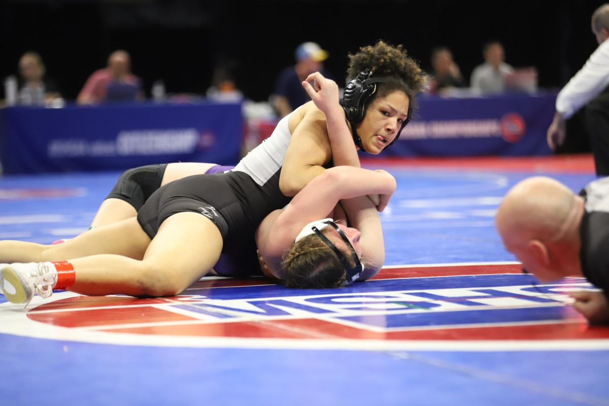 Wrestling junior Molly Marischen of Troy Buchanan, senior Ella Kimbrough (155) pins her opponent in the consolation semifinal. Kimbrough won by fall to advance to the third place match.