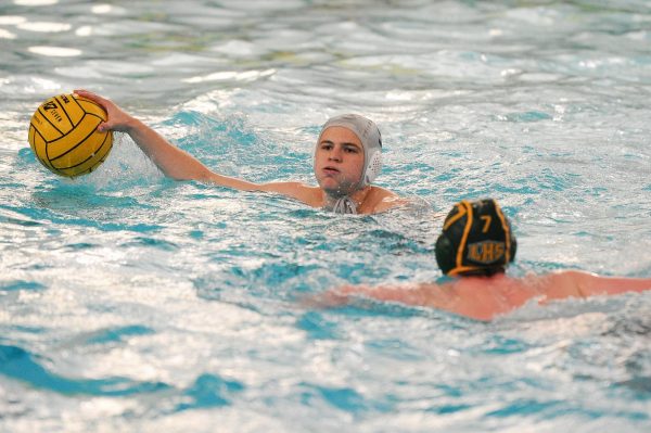 In a game against Lindbergh, senior attacker Owen Waeckerle holds the ball. The Lancers won 10-8 over the Flyers, March 23.